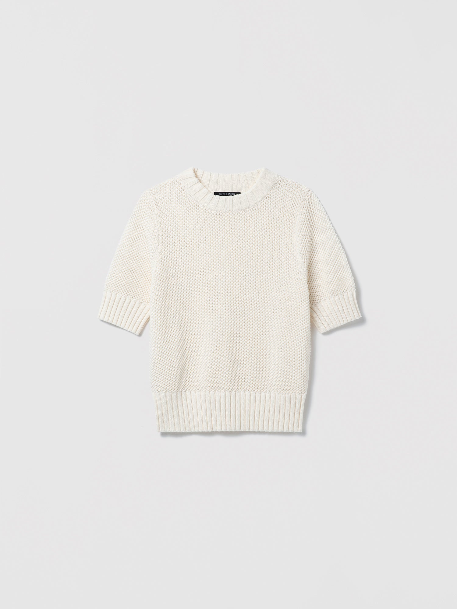 White sweater on a light gray background