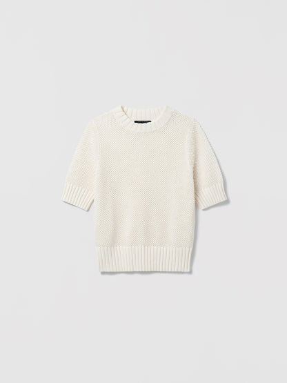 White sweater on a light gray background