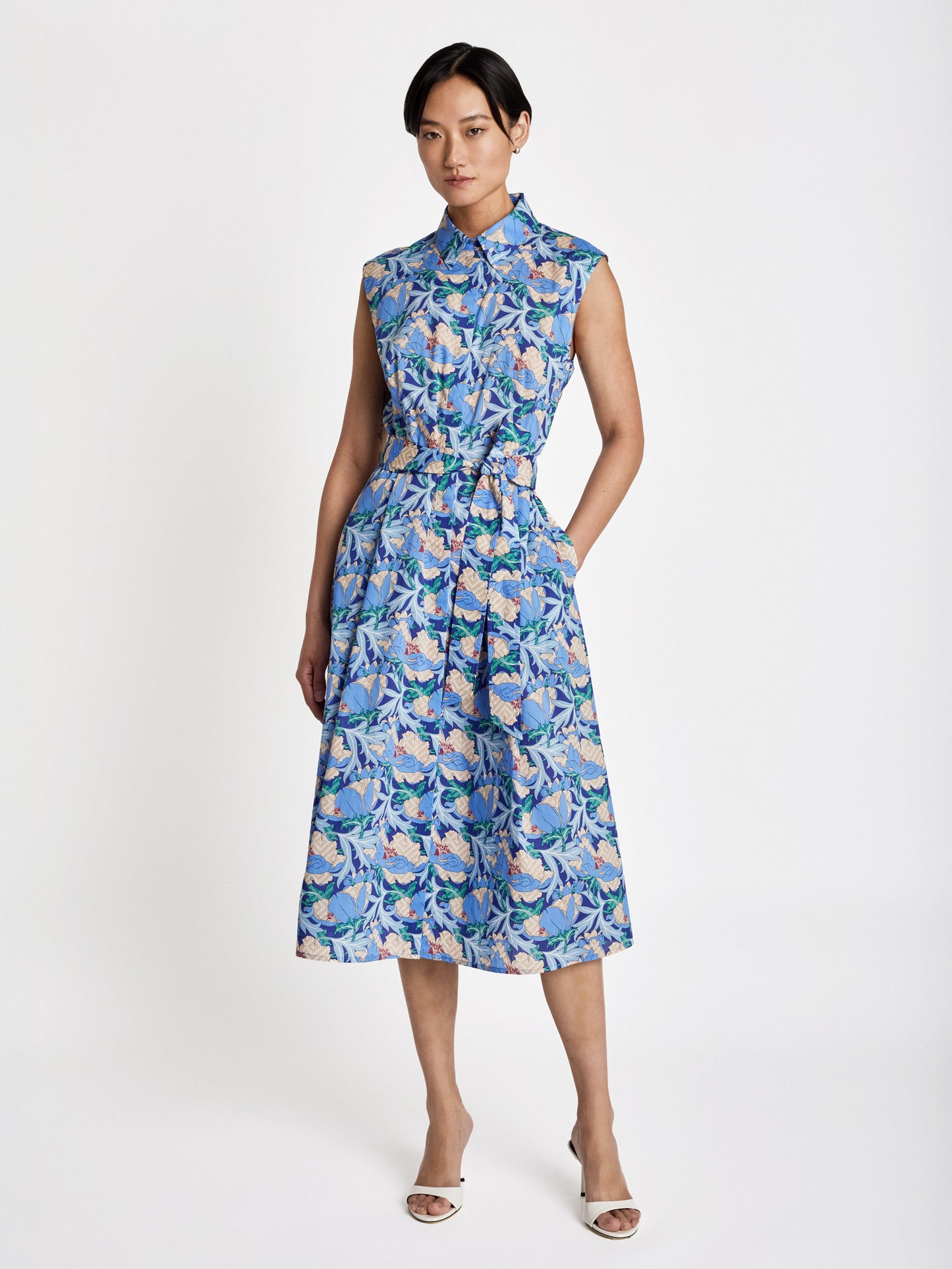 Judith and Charles Garda Dress – Cap sleeve shirt dress in Liberty print Poplin featuring a shirt collar, hidden placket button closure, side seam pockets, and belted waist; unlined, made in Canada from 100% cotton Italian fabric .