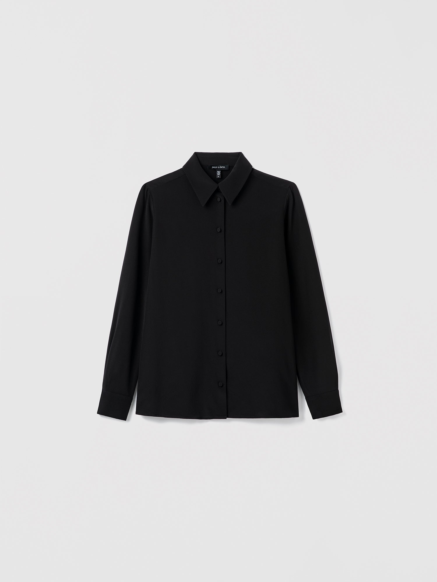 Black shirt on a light gray background