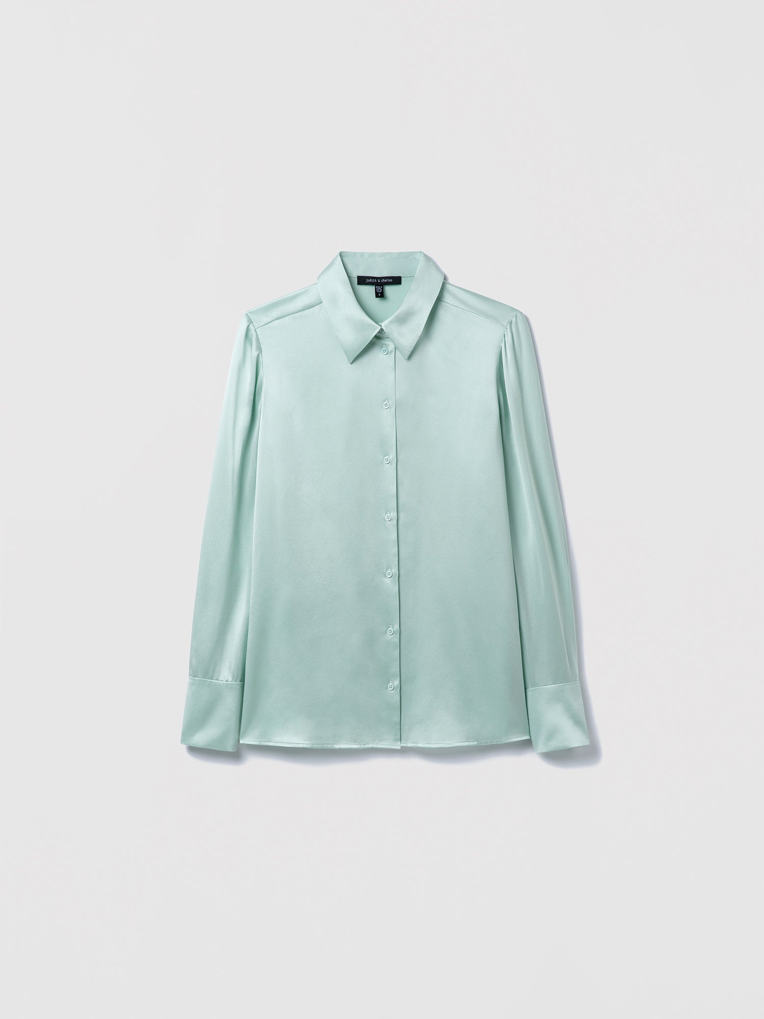 Light sage blouse on a white background