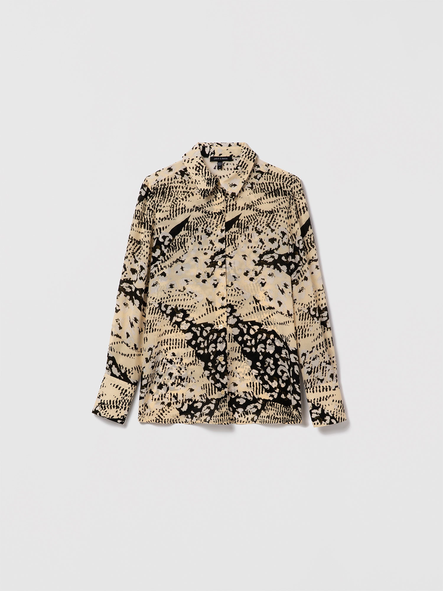 Judith & Charles black and cream animal print silk blouse with long sleeves and a semi-fitted silhouette.