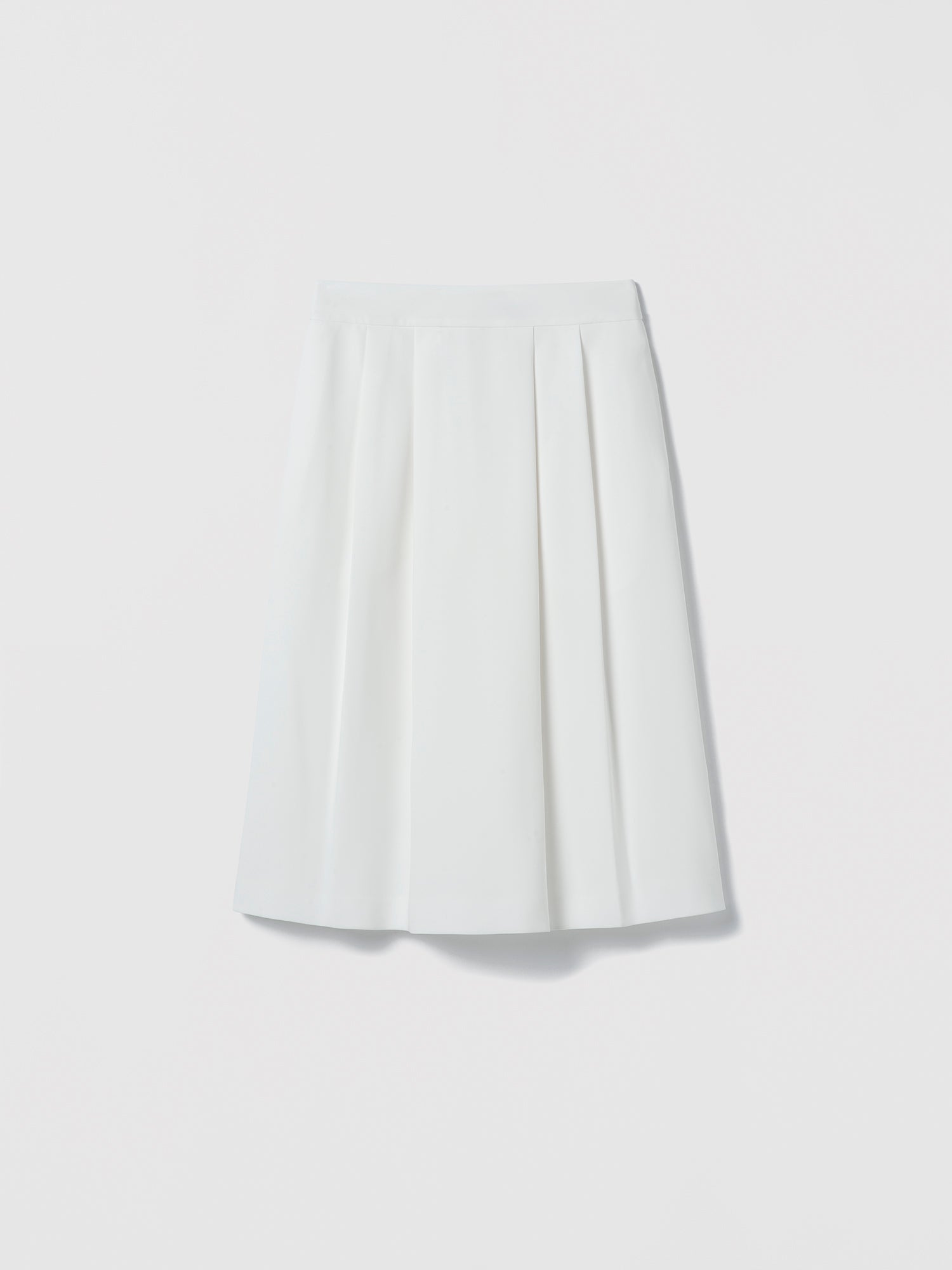 White pleated skirt on a light gray background
