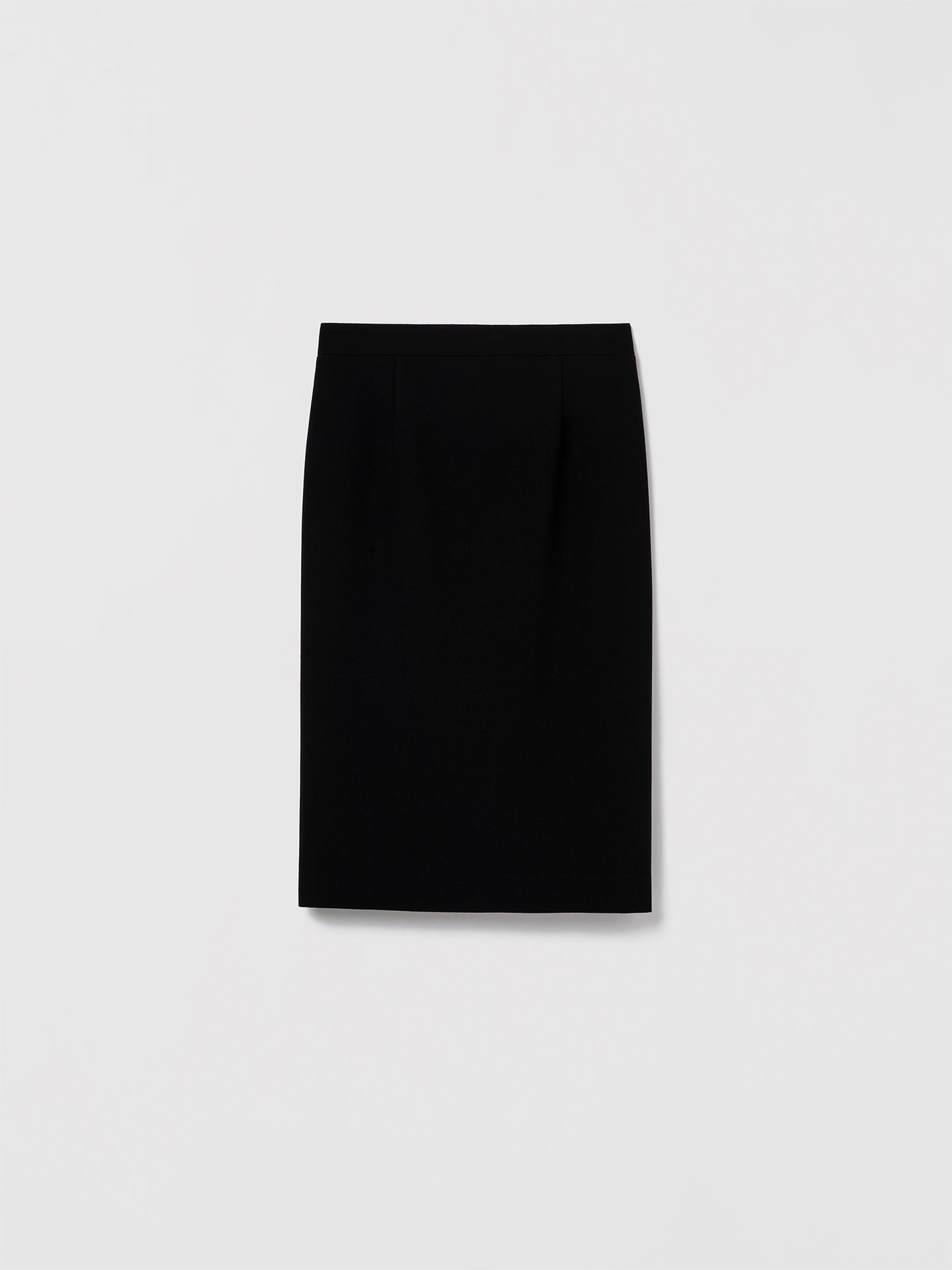 Long black fitted pencil skirt in stretch crepe with invisible back zipper closure. Made from Japanese fabric in a fluid, structured finish. Lane Skirt.