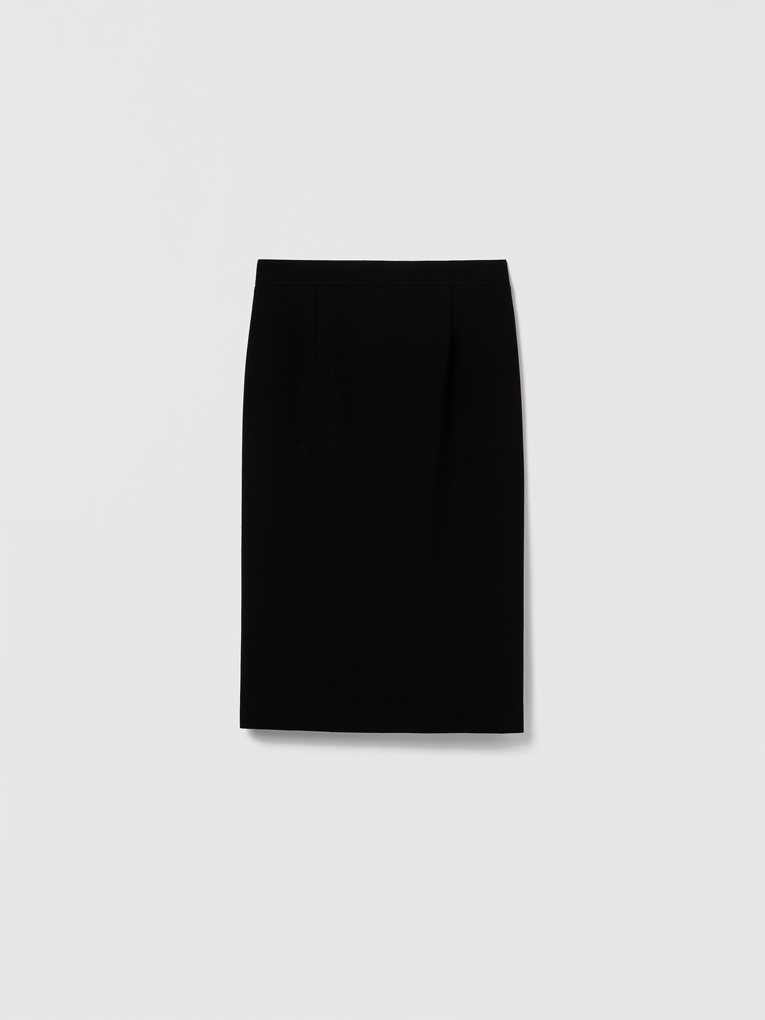 Long black fitted pencil skirt in stretch crepe with invisible back zipper closure. Made from Japanese fabric in a fluid, structured finish. Lane Skirt.