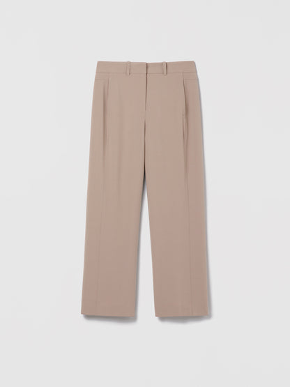 Judith & Charles High-waisted, wide-leg cropped pants in ivory satin-back crepe featuring slash pockets, back patch pockets, belt loops, and a hook-and-eye closure, displayed on a neutral background.