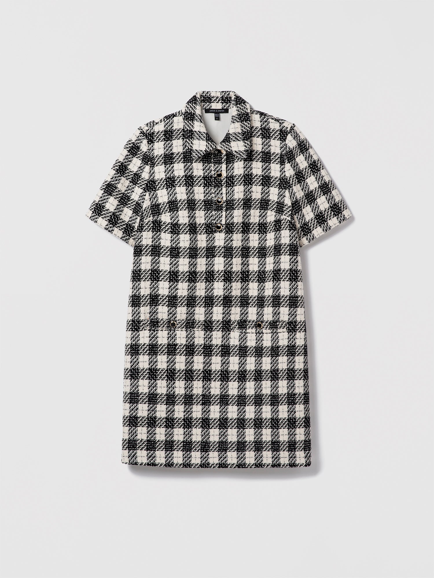 Black and white checkered dress on a light gray background