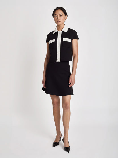 Judith and Charles Matera crop jacket in stretch crepe with cap sleeves, sharp tailoring, high-contrast trim, and a chest pocket, made in Canada (Style 600-1979)