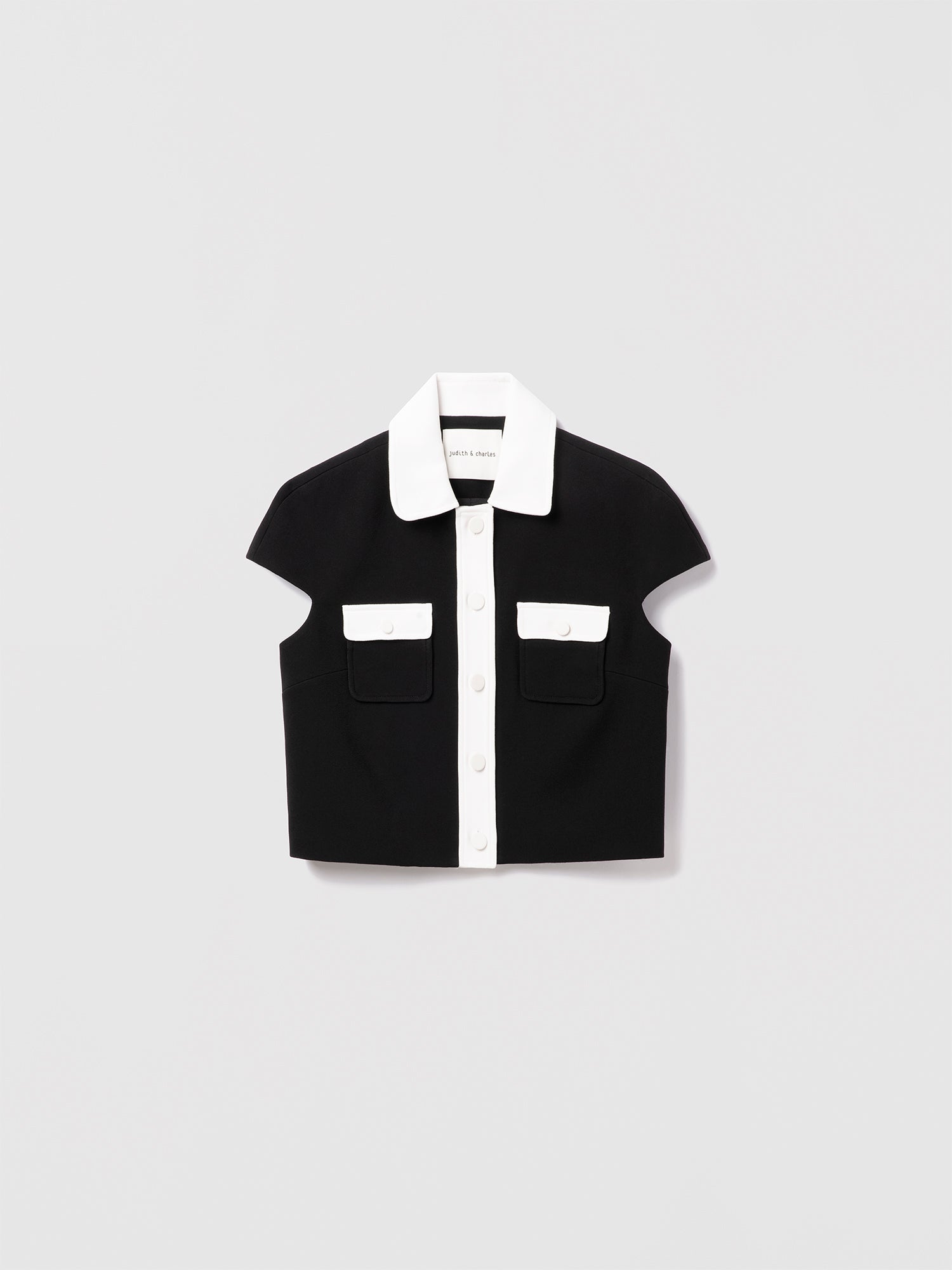 Judith and Charles Matera crop jacket in stretch crepe with cap sleeves, sharp tailoring, high-contrast trim, and a chest pocket, made in Canada (Style 600-1979)