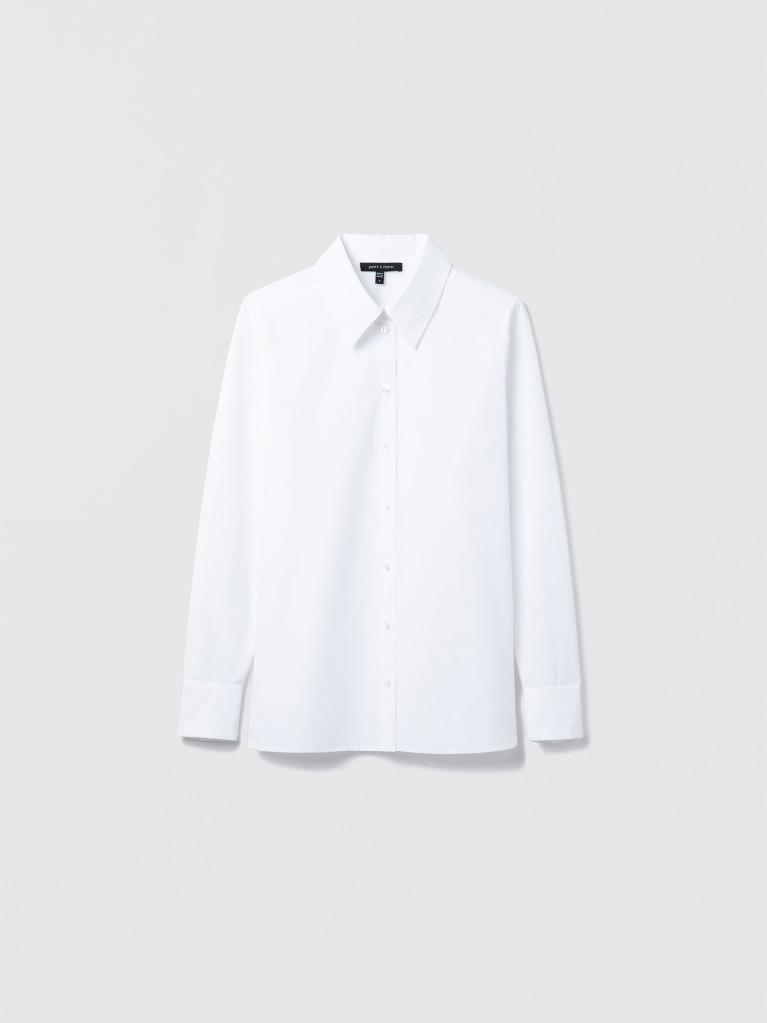Judith & Charles long sleeve white cotton blouse with spread collar and button closure, semi-fitted and unlined, made in Canada.