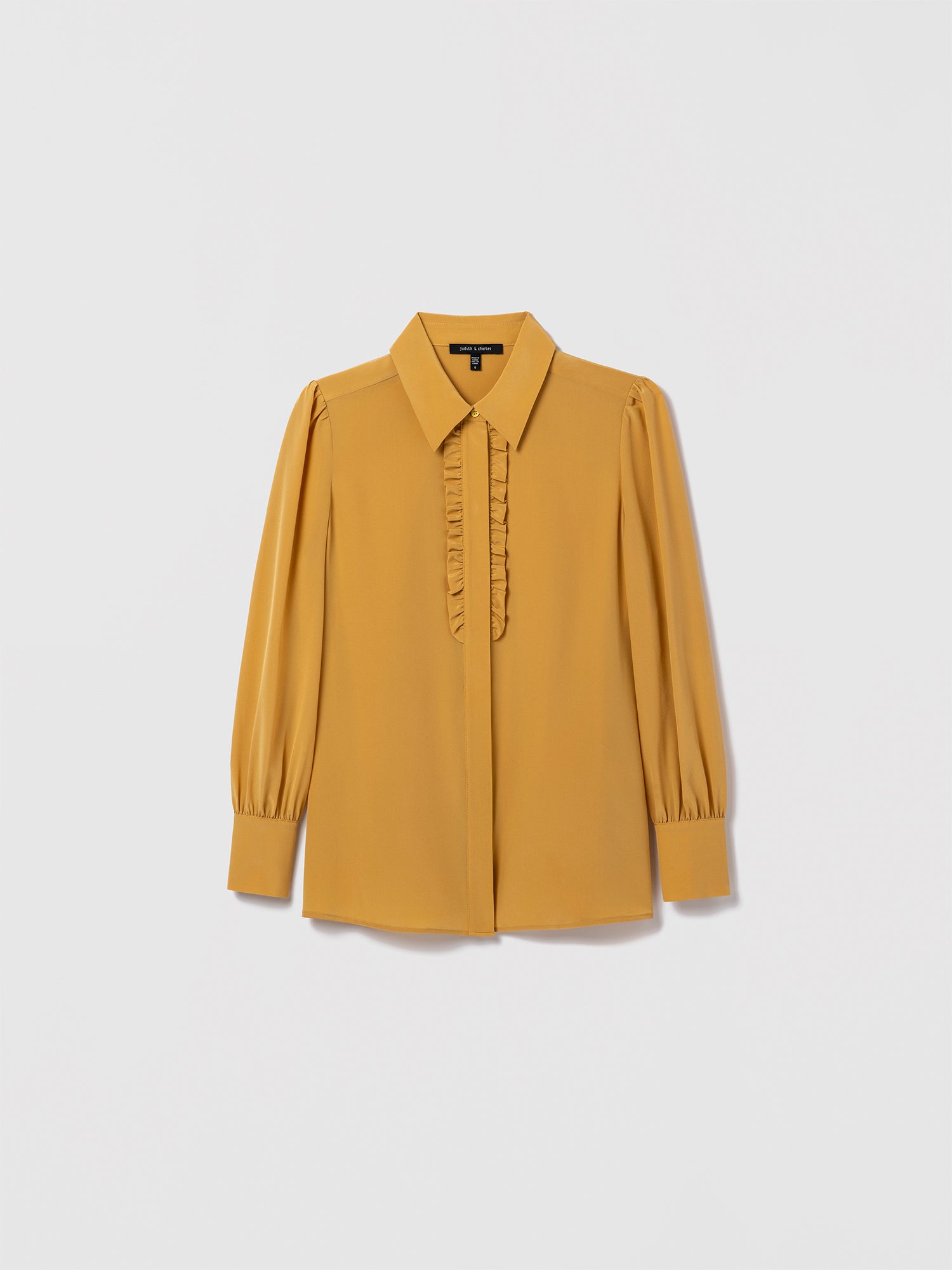 Saffron silk blouse by Judith & Charles featuring a shirt collar, hidden button placket, and double-layer ruffle detail at the front.