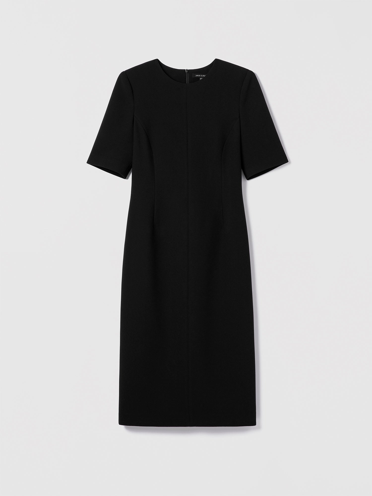 Black fitted stretch crepe dress by Judith & Charles with elbow-length sleeves, crew neck, front darts, and invisible back zipper.