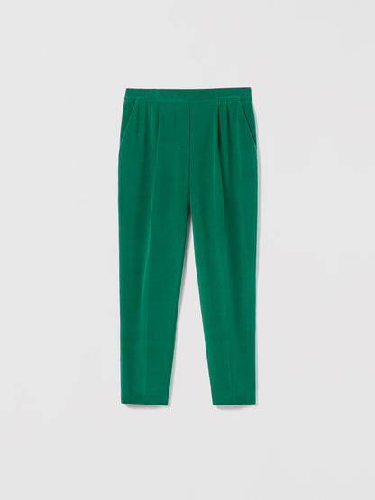 Judith and Charles Jazzy Green Seville Pant – mid-rise, slim-leg pleated trouser in sand-washed silk with elastic waist, single front pleat, and slash pockets; unlined; 26″ inseam; made in Canada 