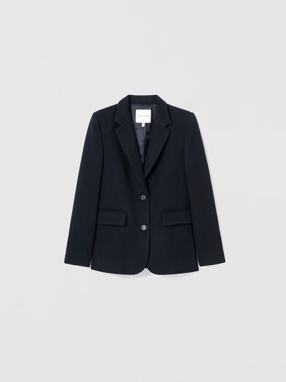 Navy blazer on a light gray background