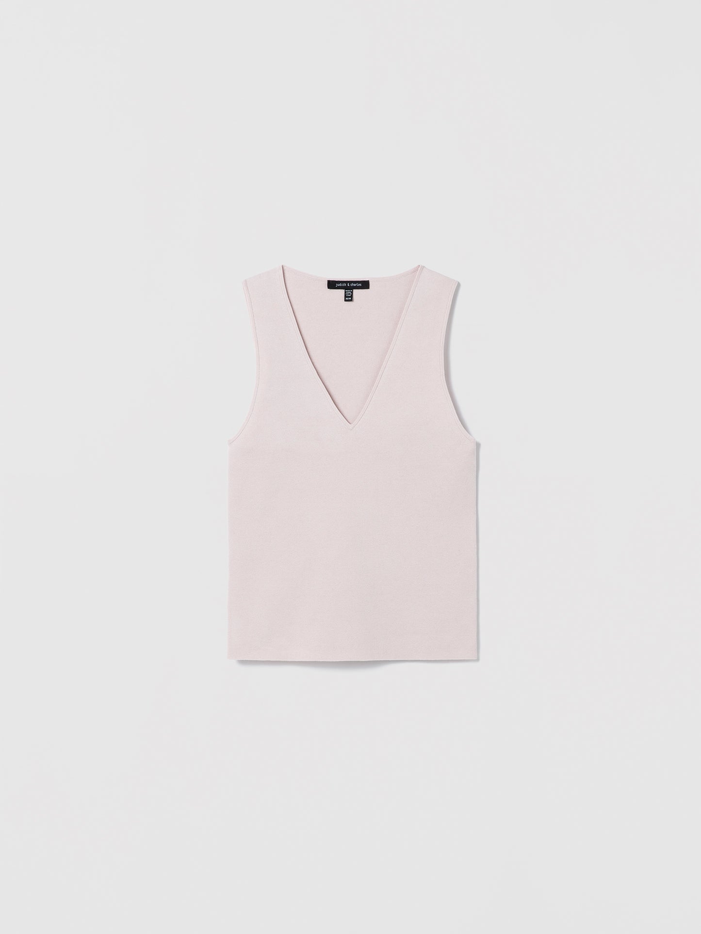 Light pink sleeveless V-neck shell top by Judith and Charles, made from a fine Italian silk-cotton blend. Features a fitted silhouette and a 21.5" back length. Style code: 266-4133.
