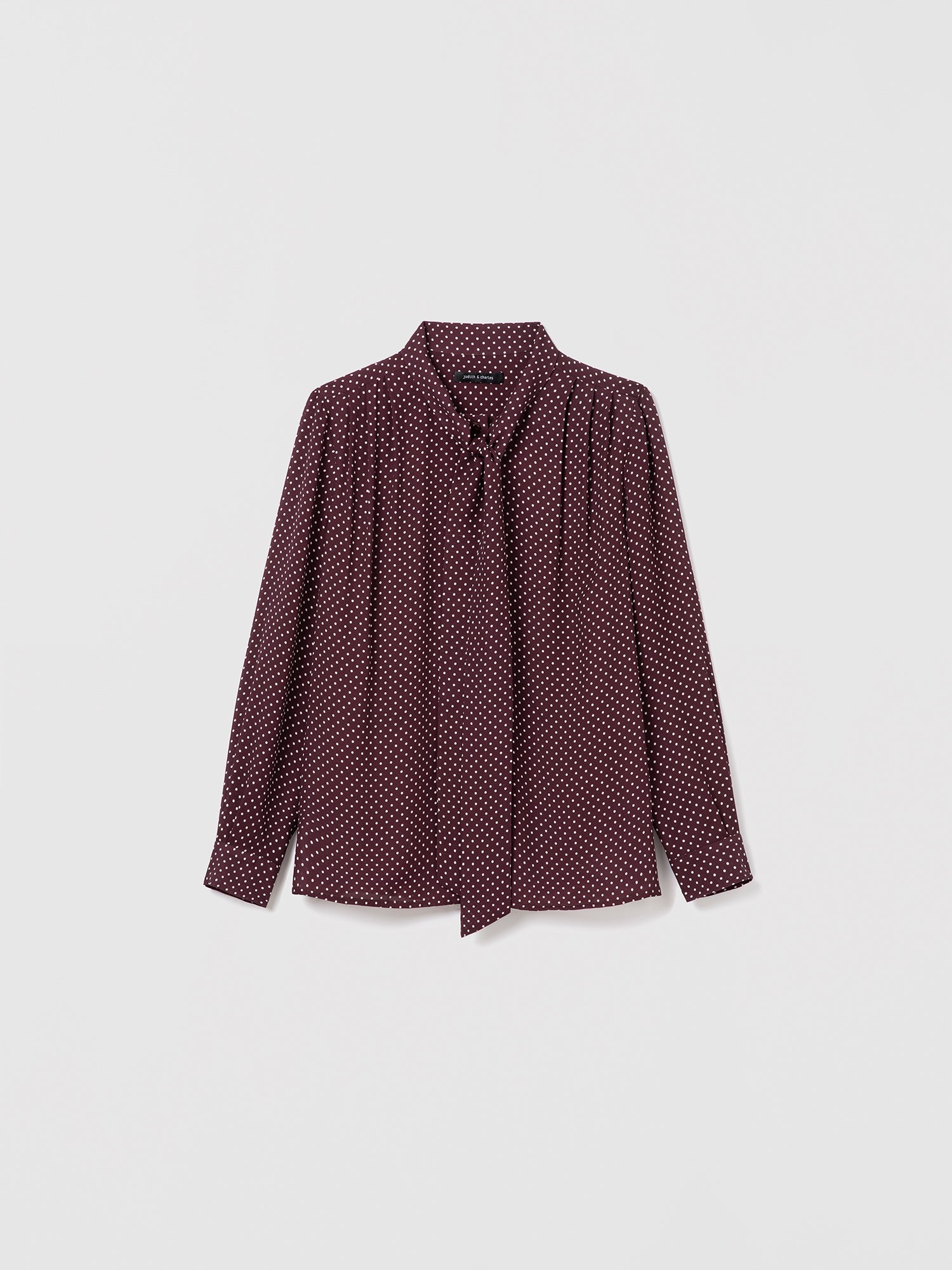Judith & Charles cherry dot silk blouse with long sleeves, pleats, and neck tie. Straight fit, unlined, with button closure.