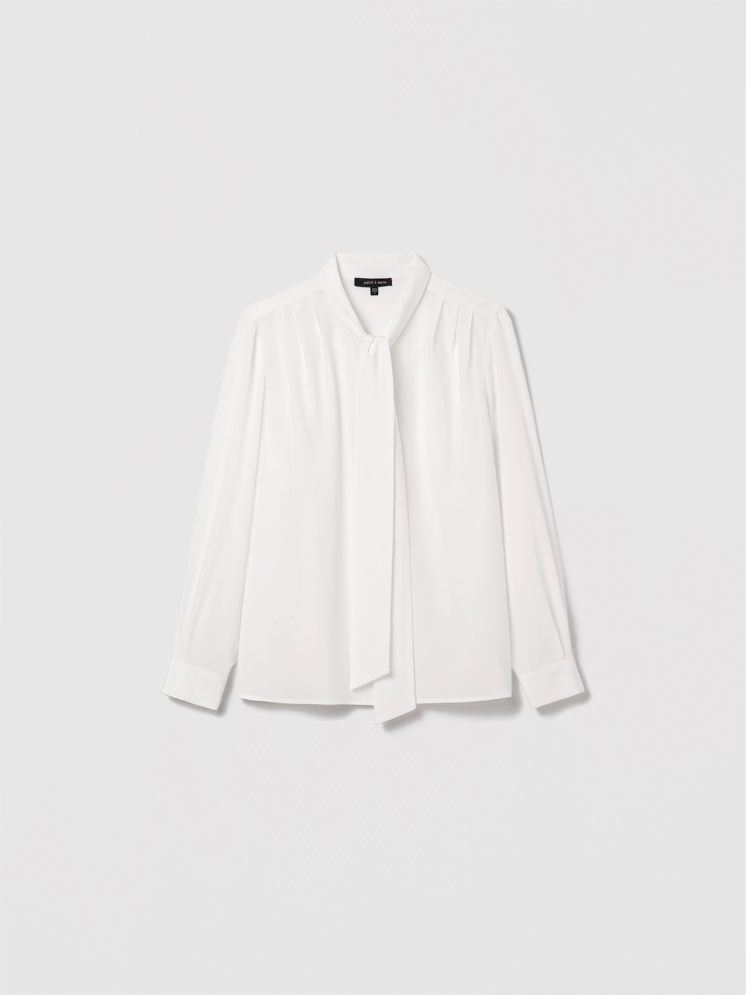 Judith and Charles off-white silk blouse, 100% silk, button closure, pleated long sleeves with cuff, and neck tie